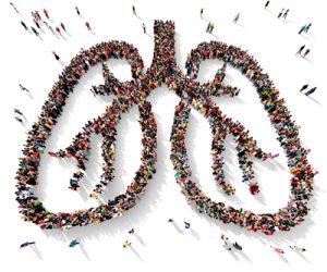 An image is made up of people shown from an aerial shot making up the shape of lungs. 
